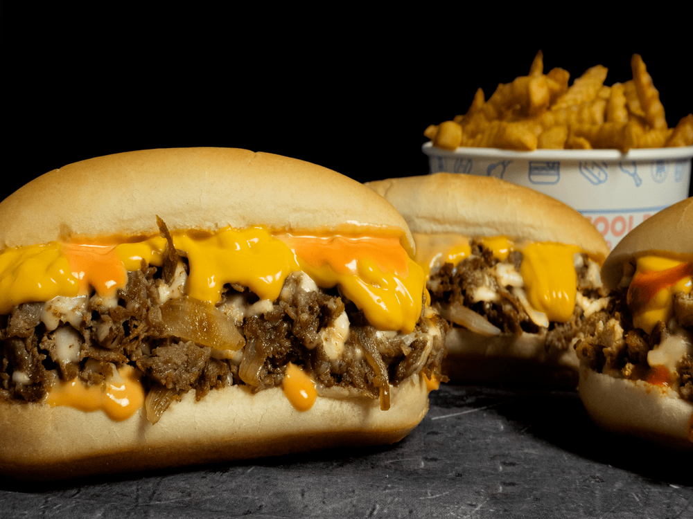 Pardon My Cheesesteak Logo
