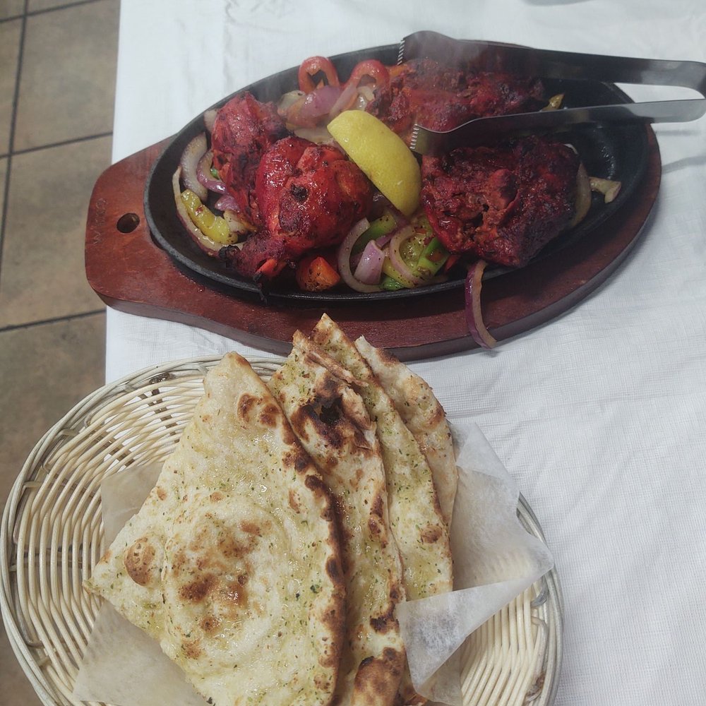 Royal Indian Restaurant - Tandoori chicken 4pcs to an order and garlic naan - Breakfast & Brunch Near Me - San Pablo, California Royal Indian Restaurant - Tandoori chicken 4pcs to an order and garlic naan - Breakfast & Brunch Near Me - San Pablo, California