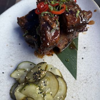 Kapow Noodle Bar - Bbq pork ribs with sliced cucumber - Asian Fusion Near Me - Delray Beach, Florida Kapow Noodle Bar - Bbq pork ribs with sliced cucumber - Asian Fusion Near Me - Delray Beach, Florida
