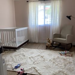 Good News Finish Carpentry - A beautiful nursery with solid oak floors, soft pink walls and glossy high class crown and base.