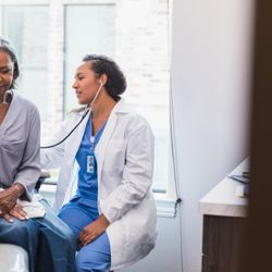 RWJ University Hospital Rahway - Female physician providing a check up.