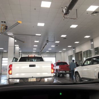 Cowboy Toyota - Service drive though.  Notice the "Big Ass Fan".  That is the Co. name. https://www.bigassfans.com/ - Auto Repair Near Me - Dallas, Texas