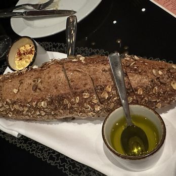 Capa - PAN RUSTICO House-Made Olive Bread, Extra Virgin Olive Oil, Saffron Butter - Spanish Near Me - Lake Buena Vista, Florida Capa - PAN RUSTICO House-Made Olive Bread, Extra Virgin Olive Oil, Saffron Butter - Spanish Near Me - Lake Buena Vista, Florida