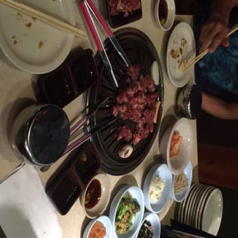 Bi Bim Bab - Grilling the meat. All the complimentary side dishes are unlimited and called banchan in Korean. - Korean Near Me - Novi, Michigan Bi Bim Bab - Grilling the meat. All the complimentary side dishes are unlimited and called banchan in Korean. - Korean Near Me - Novi, Michigan