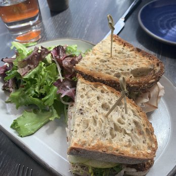 Electric Lemon - Turkey sandwich with paper thin slices of apple, crusty bread, side salad w tasty dressing. - New American Near Me - New York, New York Electric Lemon - Turkey sandwich with paper thin slices of apple, crusty bread, side salad w tasty dressing. - New American Near Me - New York, New York