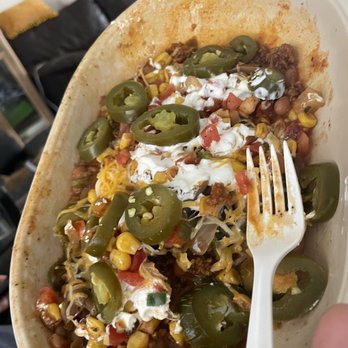 Moe's Southwest Grill - a hand holding a plate of food - Mexican Near Me - Brooksville, Florida Moe's Southwest Grill - a hand holding a plate of food - Mexican Near Me - Brooksville, Florida