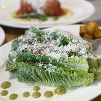 Zucchinis Cucina - lettuce with parmesan and sauce - Italian Near Me - Oakville, Ontario Zucchinis Cucina - lettuce with parmesan and sauce - Italian Near Me - Oakville, Ontario