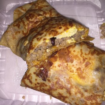 Cinnamon Tree Cafe - Breakfast sausage, bacon, egg and cheese crêpe to go.  Plenty for two meals - Creperies Near Me - Port Orange, Florida