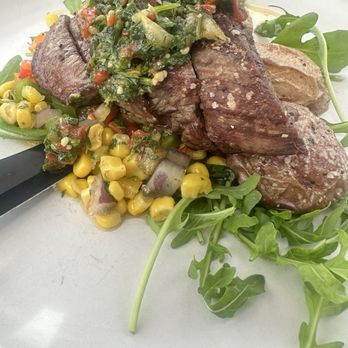 Salt & Acres - Main: flank steak with fingerling potatoes, Drizzled with chimichurri sauce and a charred corn relish - Venues & Event Spaces Near Me - Fort Lupton, Colorado Salt & Acres - Main: flank steak with fingerling potatoes, Drizzled with chimichurri sauce and a charred corn relish - Venues & Event Spaces Near Me - Fort Lupton, Colorado