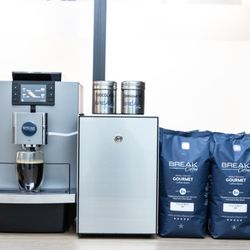 Traditional Jura X10 Office Coffee Service setup, including the coffee machine, the milk fridge and the coffee beans.