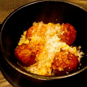 Roister - The hushpuppies ($9) were no different than what you'd get elsewhere. They came with corn crema, manchego cheese and a dusting of chili - New American Near Me - Chicago, Illinois