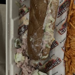 This is supposed to be a tuna sandwich on wheat. What a mess!!  First and last time I go to Firehouse Subs! $10 wasted.