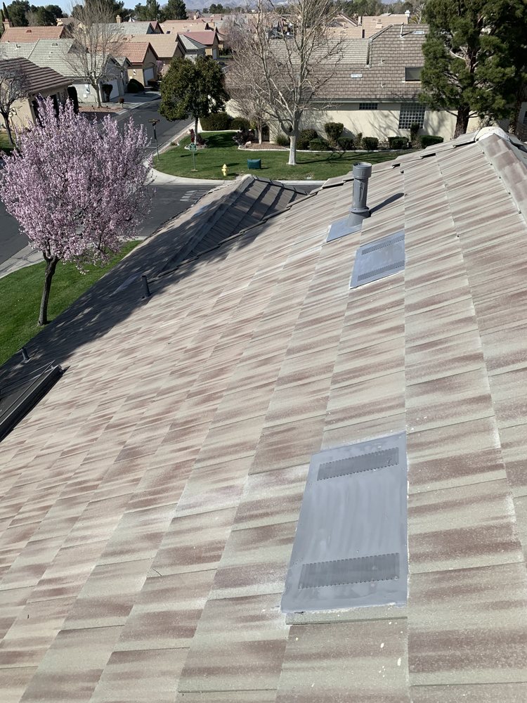 Slide of Ernestos Roofing