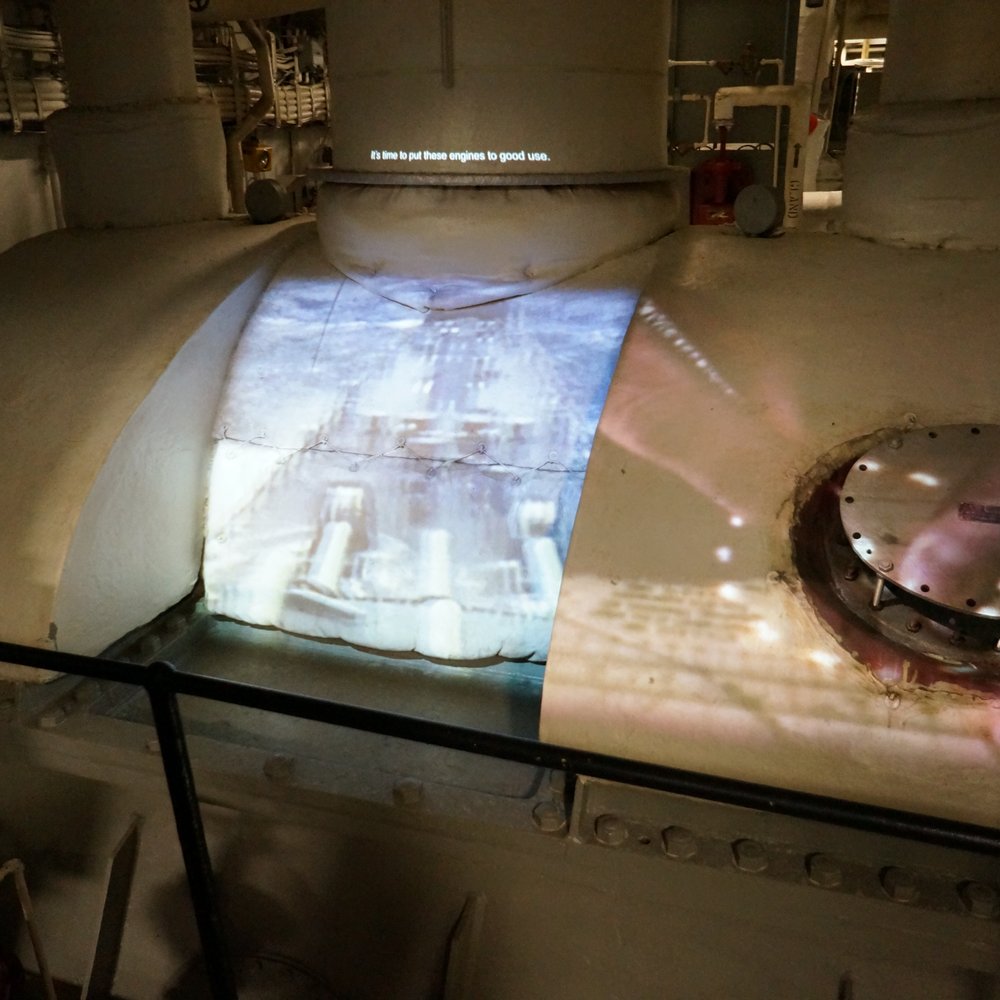 Nauticus - Engine room, a video playing on one of the LP main engine turbine housings - Museums Near Me - Norfolk, Virginia Nauticus - Engine room, a video playing on one of the LP main engine turbine housings - Museums Near Me - Norfolk, Virginia