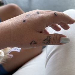 Handholding tattoo: Libra, stars, crescent moon