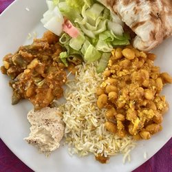 Halal Yemen Restaurant - A mix of vegetarian dishes - white beans with egg, moshakal vegetables, and hummus.