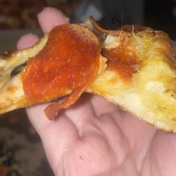 Domino's Pizza - Look closely and you can see a hair baked into the pizza
