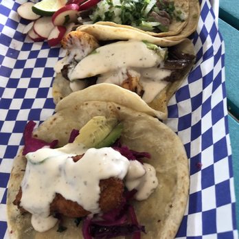 Taco Libre - Top: lengua. Middle: surf and turf. Bottom: fiery fish - Tacos Near Me - Jacksonville, Florida Taco Libre - Top: lengua. Middle: surf and turf. Bottom: fiery fish - Tacos Near Me - Jacksonville, Florida