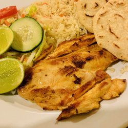 Sabor! Central American Cuisine - Meat Entree: Pechuga (chicken) with rice, a small salad, and two handmade fresh corn tortillas. Delicious! Hot and Fresh!