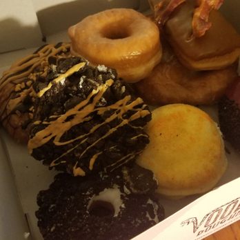 Voodoo Doughnut - Hibiscus, bacon maple, mango, apple fritter, the Dirt, Memphis Mafia....and they threw in 2 free ones!!! - Donuts Near Me - Austin, Texas Voodoo Doughnut - Hibiscus, bacon maple, mango, apple fritter, the Dirt, Memphis Mafia....and they threw in 2 free ones!!! - Donuts Near Me - Austin, Texas