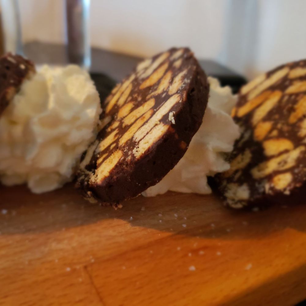 Santa Panza - three cookies on a cutting board with whipped cream - Pizza Near Me - Brooklyn, New York Santa Panza - three cookies on a cutting board with whipped cream - Pizza Near Me - Brooklyn, New York