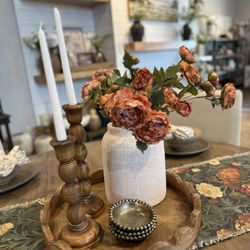 Dwellings Decor - Cozy rustic-boho centerpiece with a scalloped wooden tray, warm candlesticks, textured clay jar, and stunning rust flowers. Beautiful!
