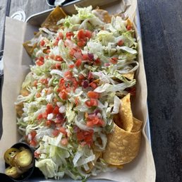 Loaded steak nachos. Very salty cheap hamburger beef Loaded steak nachos. Very salty cheap hamburger beef