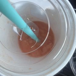 Fibers on top of the lid that I just got out of my drink SUNRISE SUNSET™