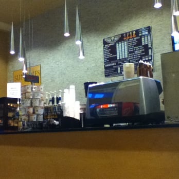 Bearclaw Coffee - a coffee shop counter with a coffee machine - Coffee & Tea Near Me - Detroit, Michigan