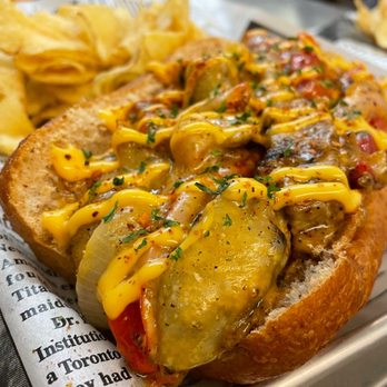 815 Gourmet Grill - a hot dog with cheese and mustard - Burgers Near Me - Smithfield, North Carolina