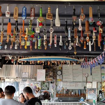 Naja's Place - You will find 100's of taps screwed into the ceiling, they are put up or taken down depending on what is flowing that particular day. - Burgers Near Me - Redondo Beach, California Naja's Place - You will find 100's of taps screwed into the ceiling, they are put up or taken down depending on what is flowing that particular day. - Burgers Near Me - Redondo Beach, California