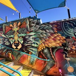 Coyote Rooftop Cantina - Beautiful mural as you wait for your table on the rooftop patio.