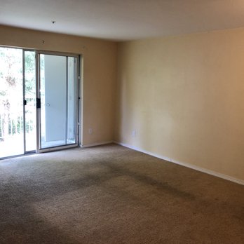 Modern Stair Nose - empty living room with sliding glass door - Flooring Near Me - Kent, Washington Modern Stair Nose - empty living room with sliding glass door - Flooring Near Me - Kent, Washington