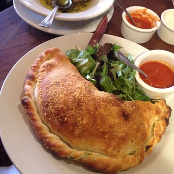 Tomatina - Calzone: mozzarella, spinach, sausage, and pesto. Side salad. - Italian Near Me - Walnut Creek, California