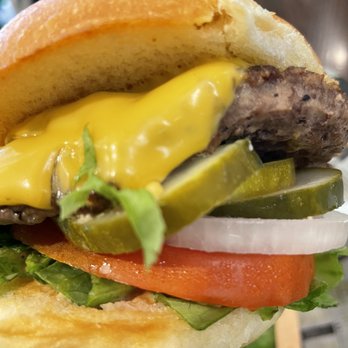 Wahlburgers - Delicious burger!! No sauce but don't need any with this many toppings! Yum! - Burgers Near Me - Boston, Massachusetts Wahlburgers - Delicious burger!! No sauce but don't need any with this many toppings! Yum! - Burgers Near Me - Boston, Massachusetts