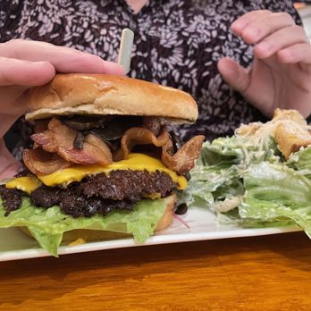 The Newsroom Pub - Bacon cheeseburger with mushrooms and caesar salad. - American Near Me - Lynden, Washington