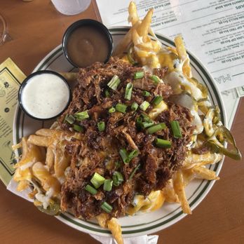 Mid City Beer Garden - Loaded cheese fries with BBQ pulled pork - Beer Gardens Near Me - Baton Rouge, Louisiana