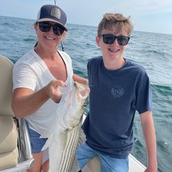 Dennis Parasail & Jet Ski - Our first striped bass- released it. But so fun to reel in.