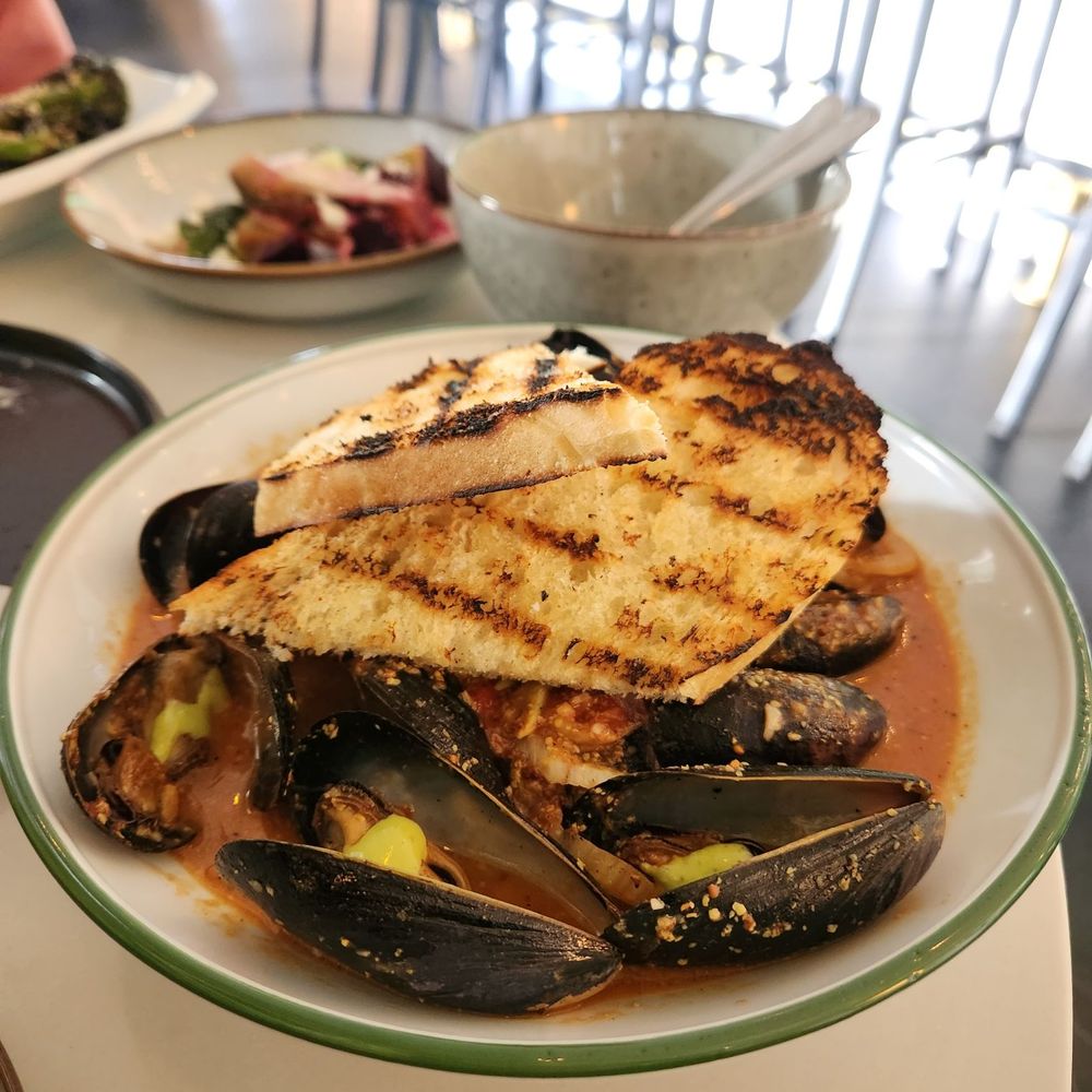 DSRT CLUB - Muscles. This is the brunch dish. Ask for more bread. The dinner dish comes with bucatini pasta. So good! - Supper Clubs Near Me - La Quinta, California DSRT CLUB - Muscles. This is the brunch dish. Ask for more bread. The dinner dish comes with bucatini pasta. So good! - Supper Clubs Near Me - La Quinta, California