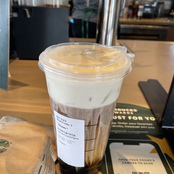 Starbucks - a cup of iced coffee on a table - Coffee & Tea Near Me - Kalamazoo, Michigan Starbucks - a cup of iced coffee on a table - Coffee & Tea Near Me - Kalamazoo, Michigan