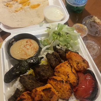 NoHo Cafe - Beef and chicken thigh with hummus added garlic spread and tomato & jalapeño - Mediterranean Near Me - North Hollywood, California NoHo Cafe - Beef and chicken thigh with hummus added garlic spread and tomato & jalapeño - Mediterranean Near Me - North Hollywood, California
