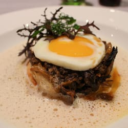 Poached egg on top of delicious greens.
