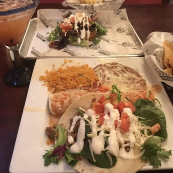 Cantina Louie - Pineapple sunrise . Sope, dinner plate with ground beef taco, beef burrito (which looked more like enchilada to me), rice and beans - Mexican Near Me - St. Augustine, Florida