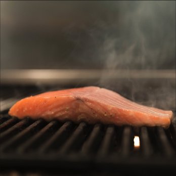 Eatsy - a piece of salmon cooking on a grill - Food Delivery Services Near Me - Miami, Florida