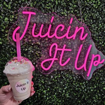 Juicin It Up - a hand holding a drink in front of a juicin it up sign - Juice Bars & Smoothies Near Me - Saxonburg, Pennsylvania Juicin It Up - a hand holding a drink in front of a juicin it up sign - Juice Bars & Smoothies Near Me - Saxonburg, Pennsylvania