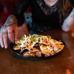 Kind Spirits - Nachos with house queso sauce, fresh made pico de gallo, lime crema, and spicy mayo