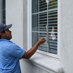 Window Hero Charlotte - Joe cleaning a large single pane window.