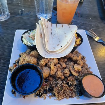 Caribbean Jack's - Gator Tacos, breaded with jerk sauce on the side - Caribbean Near Me - Daytona Beach, Florida Caribbean Jack's - Gator Tacos, breaded with jerk sauce on the side - Caribbean Near Me - Daytona Beach, Florida
