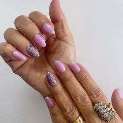 Iridescent nails with a glitter accent!