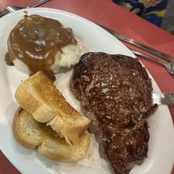 Huddle House - Ribeye Steak* (8 oz.) Dinner and mashed potatoes brown gravy